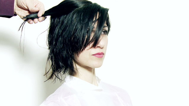 Fashion hair stylist cutting long layers
