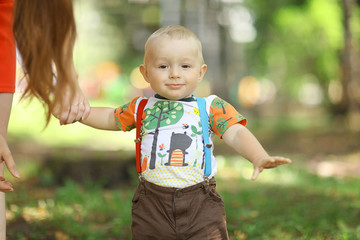 young family with a child in a summer park