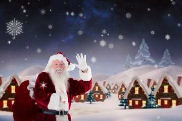 Composite image of santa claus waving