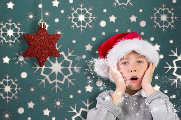 Composite image of festive surprised boy
