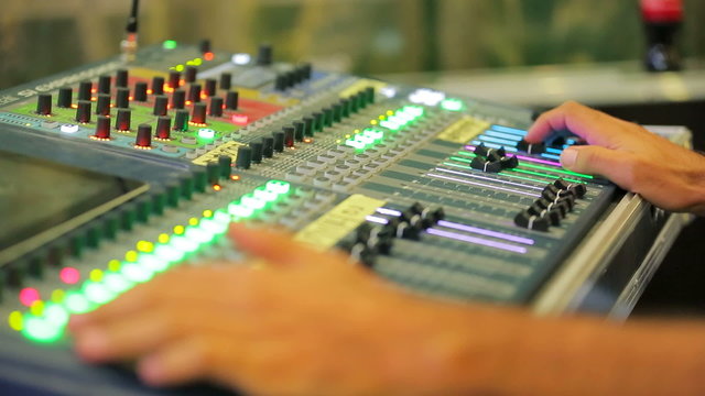 Close Up of A Man Working on Mixing Control Panel