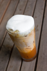 Iced coffee with milk is on the table.