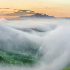 Top of the mountain surrounded by mists