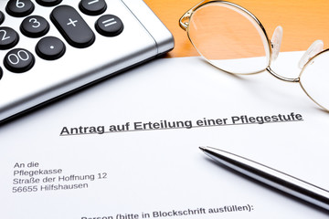Antrag Erteilung Pflegestufe Taschenrechner Stift