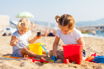  girls playing on  beach