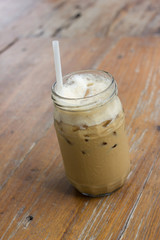Iced coffee with milk is on the table.