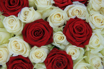 Red and white roses in a wedding arrangement