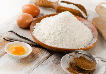 Baking ingredients  on a  white  wooden table