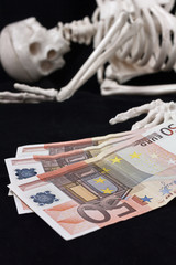 Skeleton and money