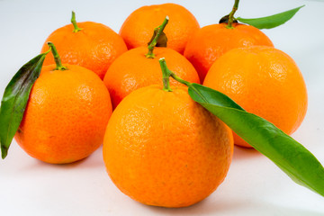 some sweet tangerines  on white