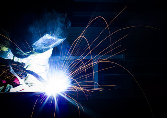 Welding steel structures with sparks - obrazy, fototapety, plakaty