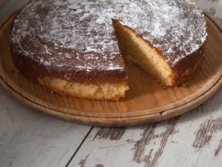Sponge cake of lemon over wooden background