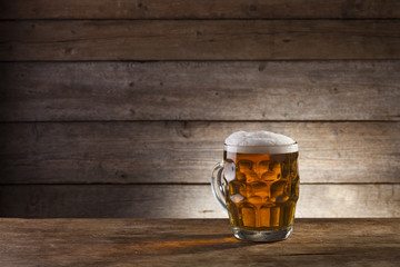 Beer on a wooden background with copy space