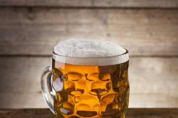 Beer on a wooden background with copy space