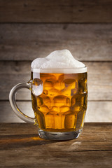 Beer on a wooden background with copy space