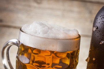 Beer on a wooden background with copy space