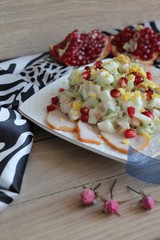 salad of smoked chicken breast with pomegranate and kiwi