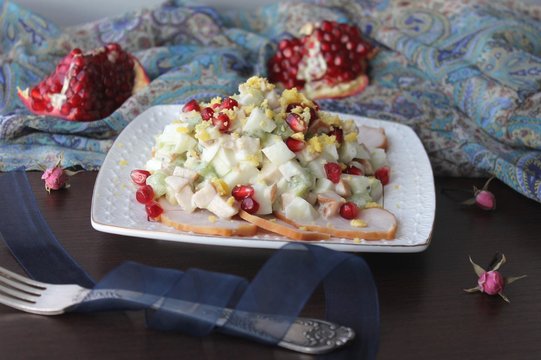 salad of smoked chicken breast with pomegranate and kiwi
