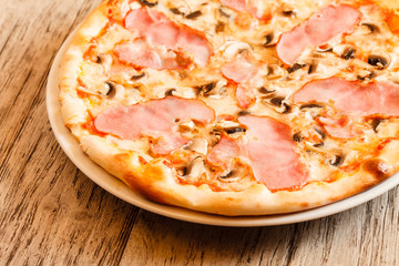 pizza on wooden background