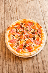 pizza on wooden background