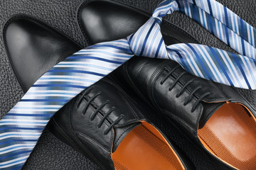 Fashion background of shoes and tie