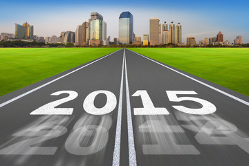 New Year 2015 on running track concept with modern city.