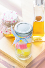 colorful jelly and bottles of honey