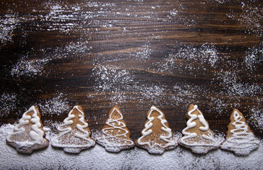 New Year composition with ginger cookies with powdered sugar on