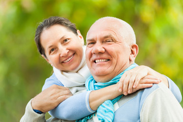 Fototapeta premium Happy mature couple in autumn park