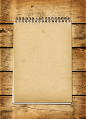 Blank vintage notebook on a wood board