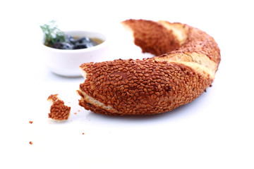 Turkish bagel, simit, and traditional tea on a table