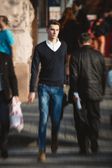 Young man cross the street