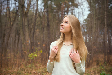 Girl with long hair in autumn forest