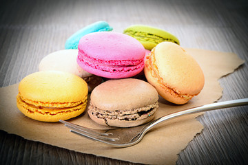 Sweet Tasty Macaroons on Wooden Background