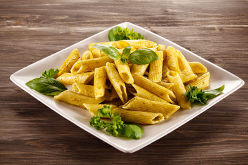 Pasta with pesto sauce, parmesan and vegetables