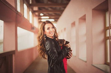 Young girl with with dog long hair in the urban landscape