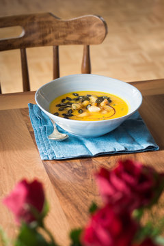 Pumpkin soup with caramelized apples, seeds and balsamic vinegar