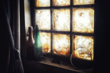 Old dirty window with dusty bottles - 73161620