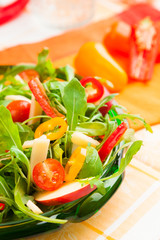 Healthy salad with fresh vegetables in a glass plate