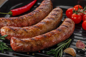 grilled sausages in a pan