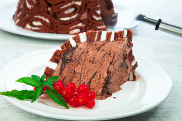 slice of ice cream cake, of chocolate, with fresh fruits