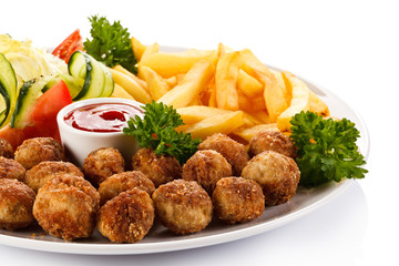 Roast meatballs, French fries and vegetable salad