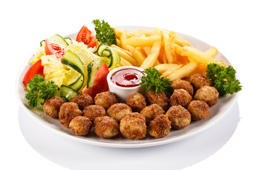 Roast meatballs, French fries and vegetable salad