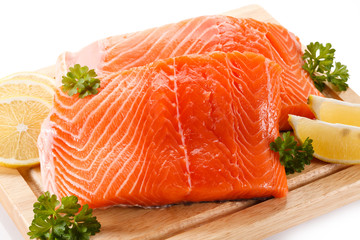 Fresh raw salmon fillet on cutting board