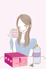 サプリメントボトルを持つ女性