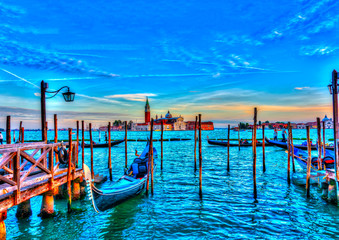 several Gondolas docked at Venice Italy. HDR