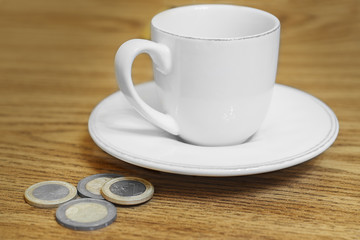 cup of coffee on the table coin