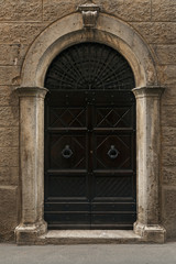 Old door in a traditional Tuscan building