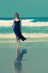 Beautiful young woman at the beach