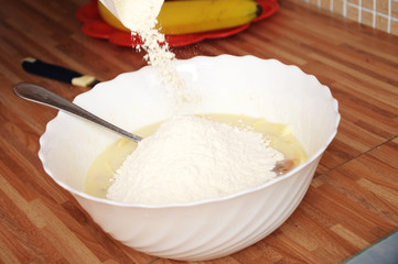 Adding flour in dough